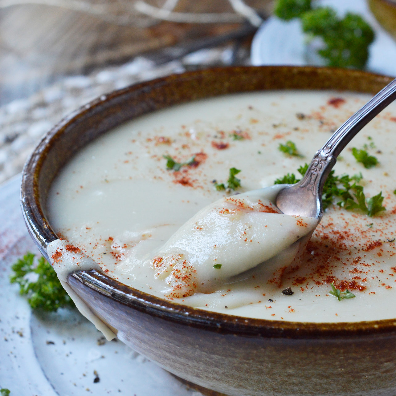 Make this Creamy Roasted Garlic Parsnip Soup Recipe to warm you up on chilly Winter days. Just 5 ingredients and about 30 minutes to make this healthy meal that is perfect for a vegetarian dinner!