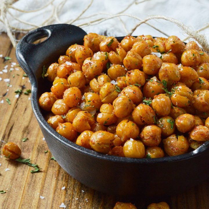 If you're looking for a healthy snack to satisfy that salty, crunchy craving, these Crispy Roasted Chickpeas are it! Learn how to toast chickpeas in the oven making them a nutritious high protein snack recipe.