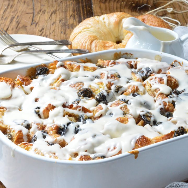 Go ahead and indulge your sweet craving with this Rum Raisin Croissant Bread Pudding Bake Recipe. Perfect for a dessert to feed a crowd or as an easy breakfast casserole.