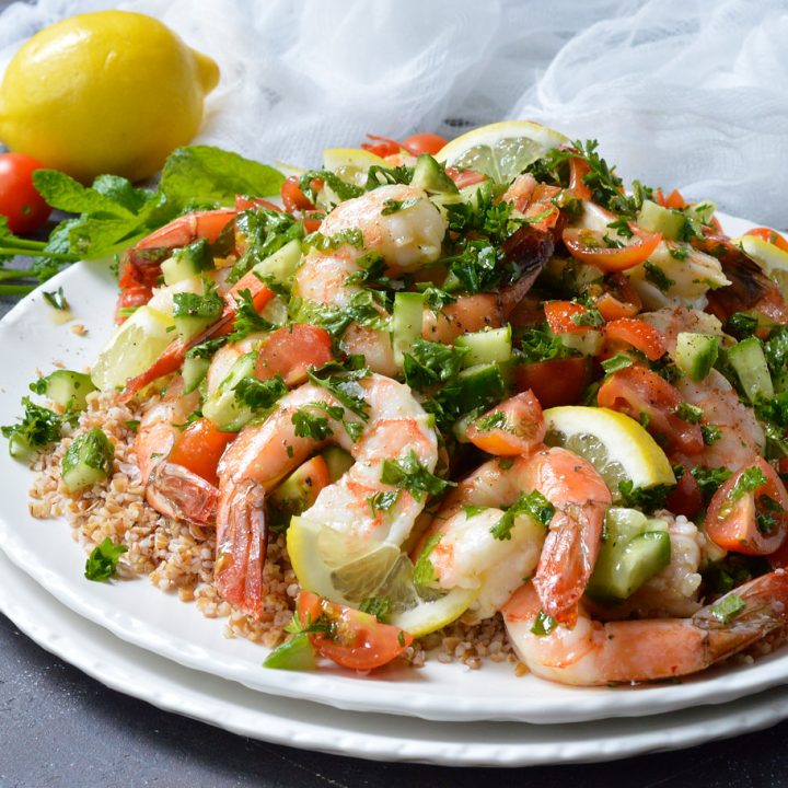 Looking for a healthy, nutritious meal with tons of flavor? This Tabouli Shrimp Salad Recipe has it all! Made with the traditional tabbouleh ingredients of mint, parsley, lemon, tomatoes, cucumber and lemon. The addition of shrimp makes this a satisfying meal that is great for lunch or dinner.