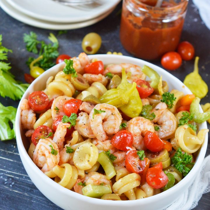 If you are looking for bold and unique flavors, this Bloody Mary Shrimp Pasta Salad Recipe will be a hit! This cold shrimp pasta salad has no mayo and all the great flavors of a Bloody Mary cocktails, without the vodka. This is a perfect party side dish!