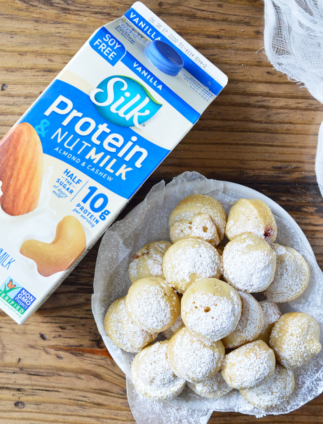 Want pancakes for breakfast without all the flipping? This Baked Dairy Free Pancake Muffins Recipe is super easy to make and great for feeding a hungry crowd! Not only are these pancake bites light and fluffy, they are also filled with strawberry jam!
