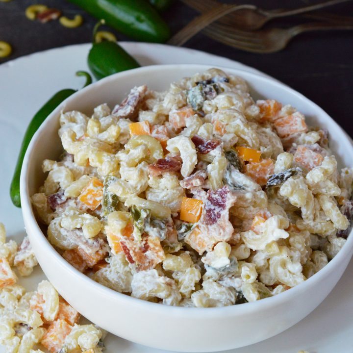 Just in time for barbecue season, this Jalapeño Popper Macaroni Salad Recipe makes a fantastic side dish! Your favorite pasta salad made with cheddar, bacon and roasted jalapeños for a fun twist. Pack it up in your branded Koozie® Grocery Tote Kooler and take the family on a picnic.