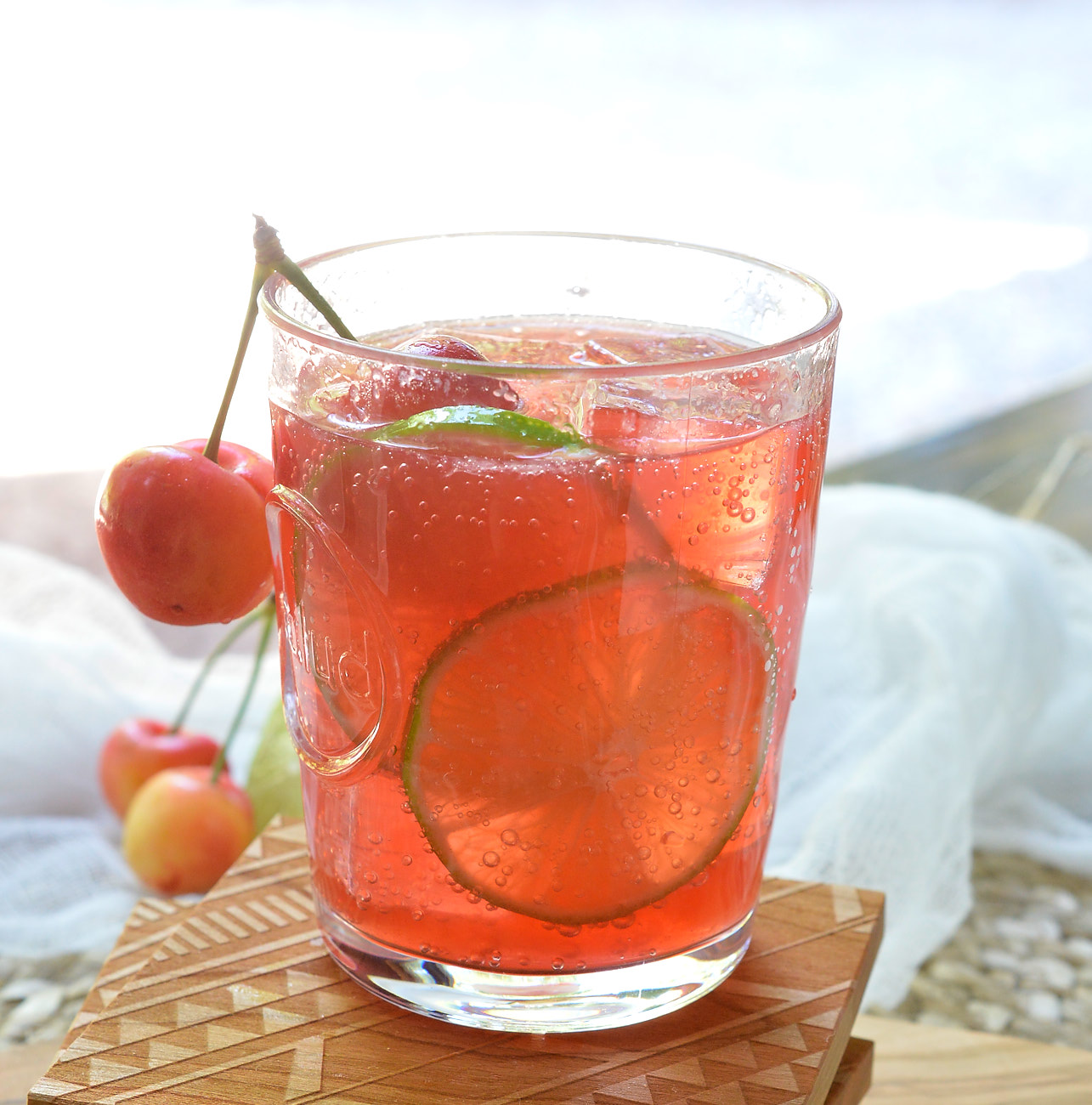 Warm summer days can only get better with this refreshing Cherry Lime Tequila Cocktail! This simple summertime drink recipe is made with fresh lime, tart cherry juice, tequila and 7UP. Perfect for entertaining or a day at the lake!