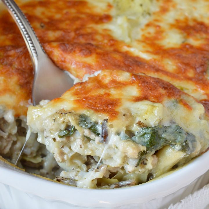 Spinach Artichoke Wild Rice Casserole is perfect for those busy weeknights. This family dinner recipe is nutritious and full of flavor!