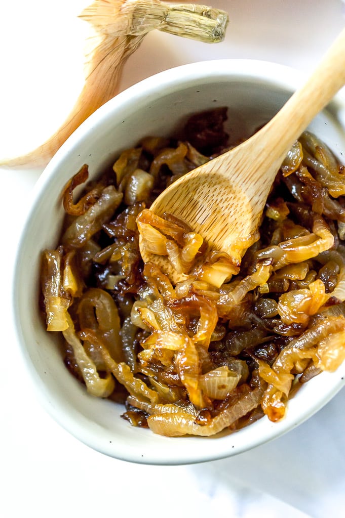 white bowl filled with golden brown caramelized onions