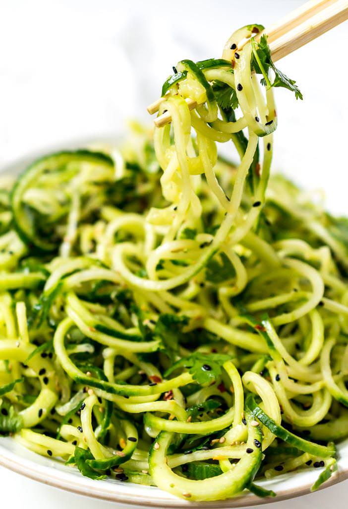 chopsticks picking up the Asian Cucumber Salad Recipe