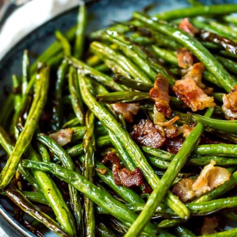 close up photo os roasted green beans with bacon