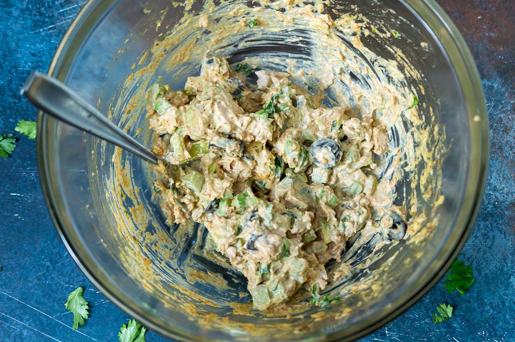 taco tuna salad in clear bowl with spoon
