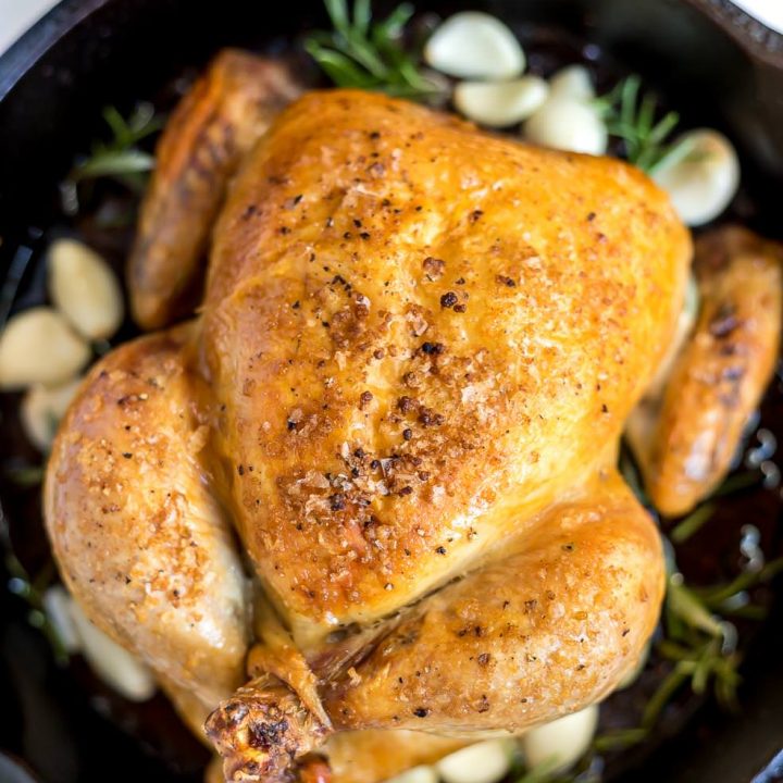 perfectly golden roast chicken in cast iron skillet