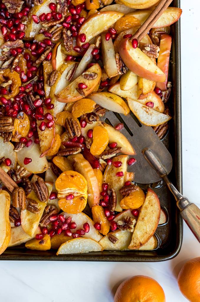 baked apples, pears and mandarins on a baking sheet