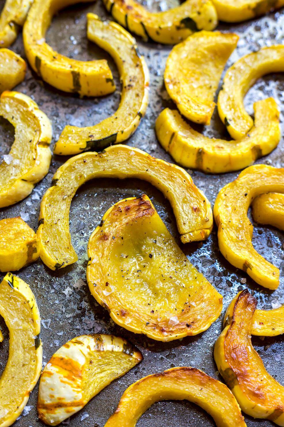 delicata squash recipe on rimmed baking sheet just out of the oven