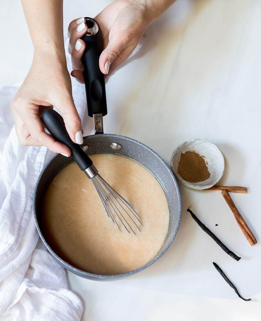 paleo vegan coffee creamer in a pot being whisked 