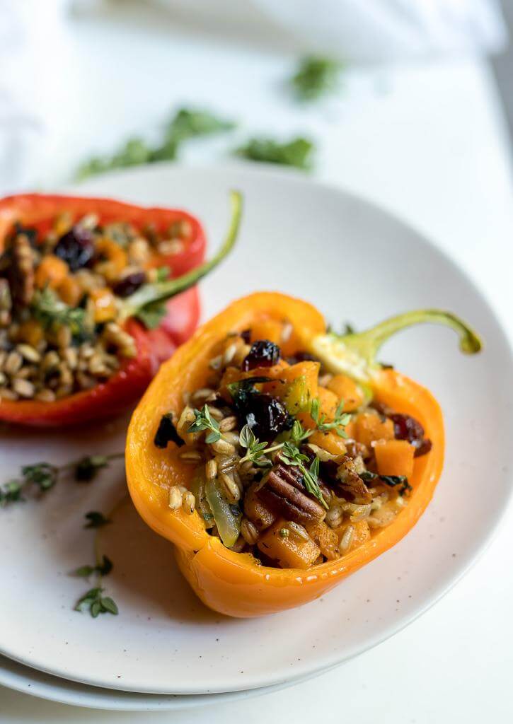 faro salad stuffed peppers recipe on white plate with white background