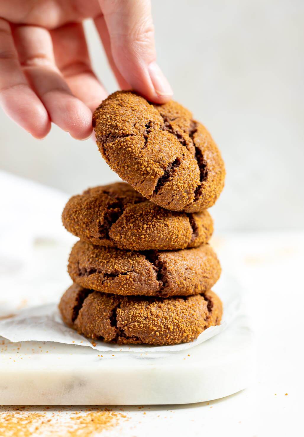 hand grabbing a ginger cookie