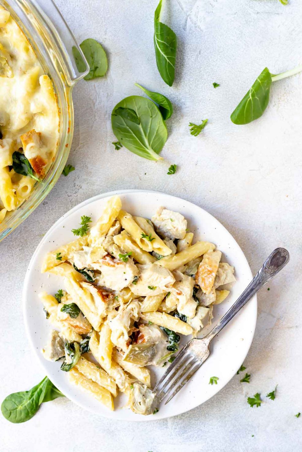 chicken alfredo baked ziti recipe served on white plate with silver fork