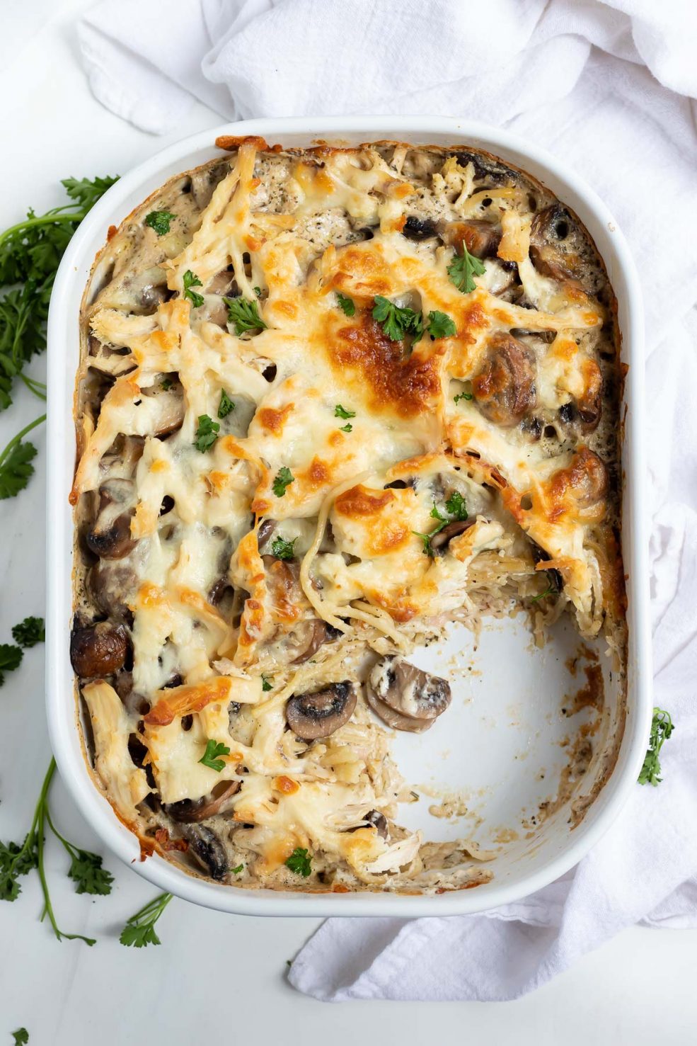 Chicken Tetrazzini in white casserole dish