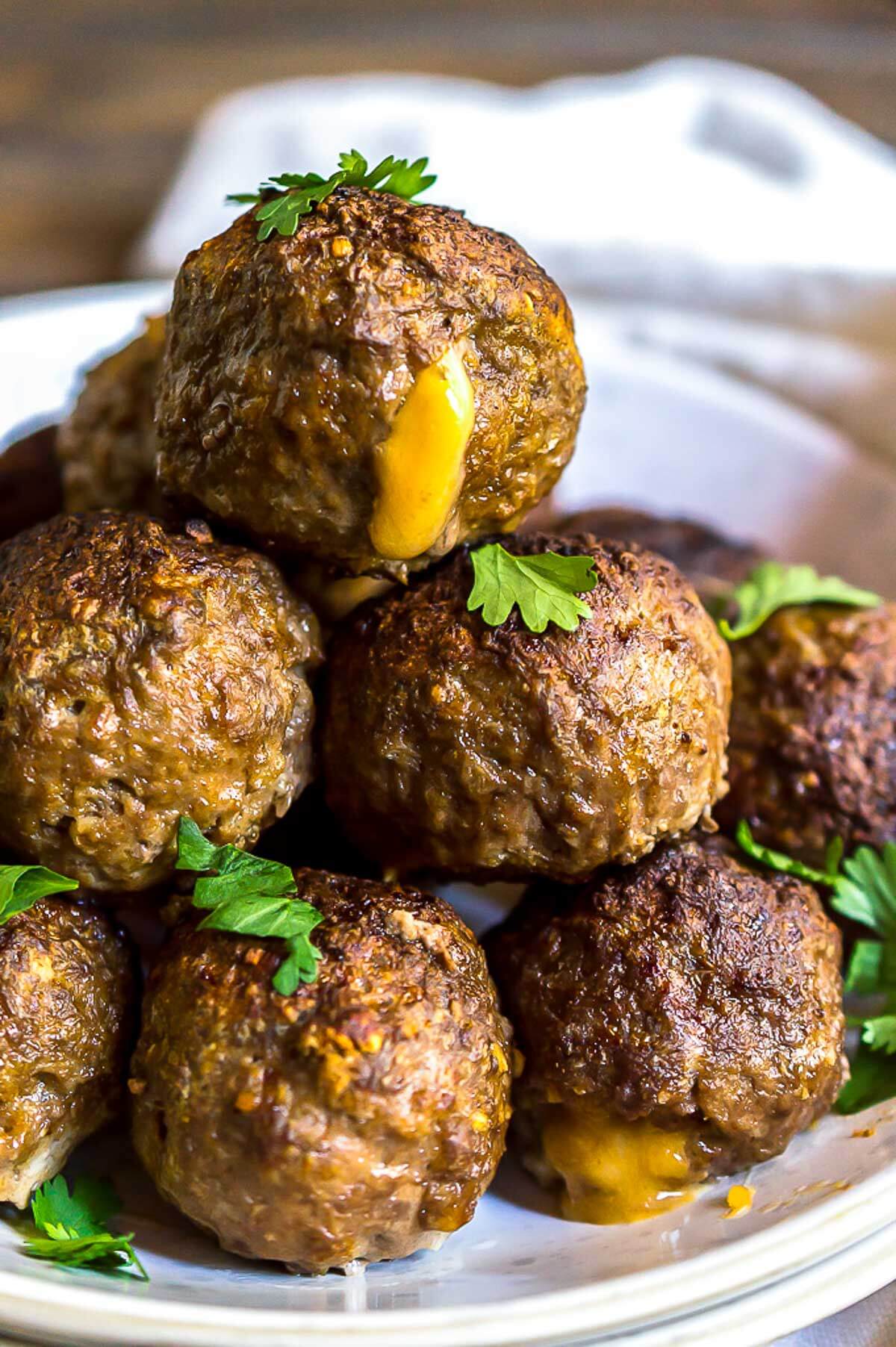 cheese stuffed meatballs on white platter