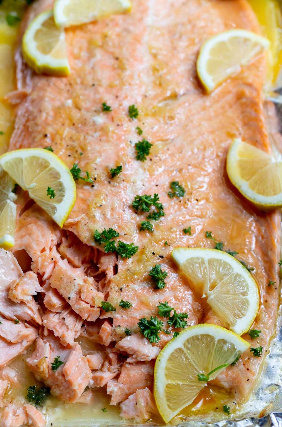 honey garlic salmon in a buttery sauce, topped with lemon and parsley