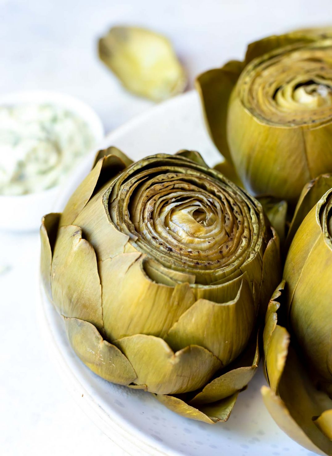 pressure cooker artichoke served on white plate