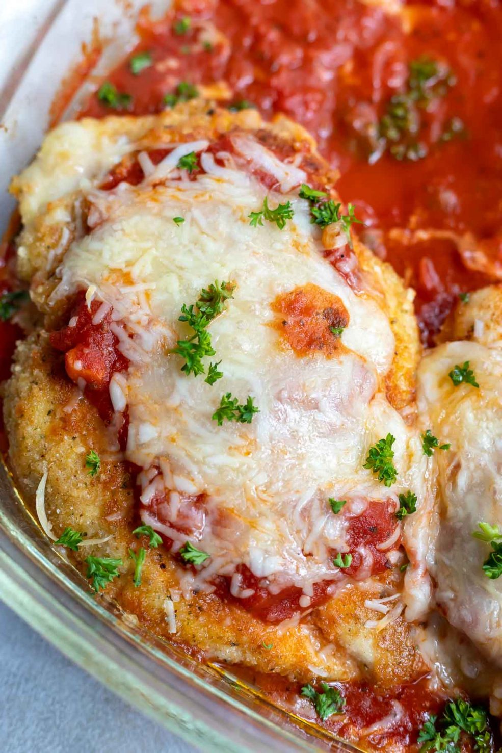 golden fried chicken farm topped with marinara and melted mozzarella cheese