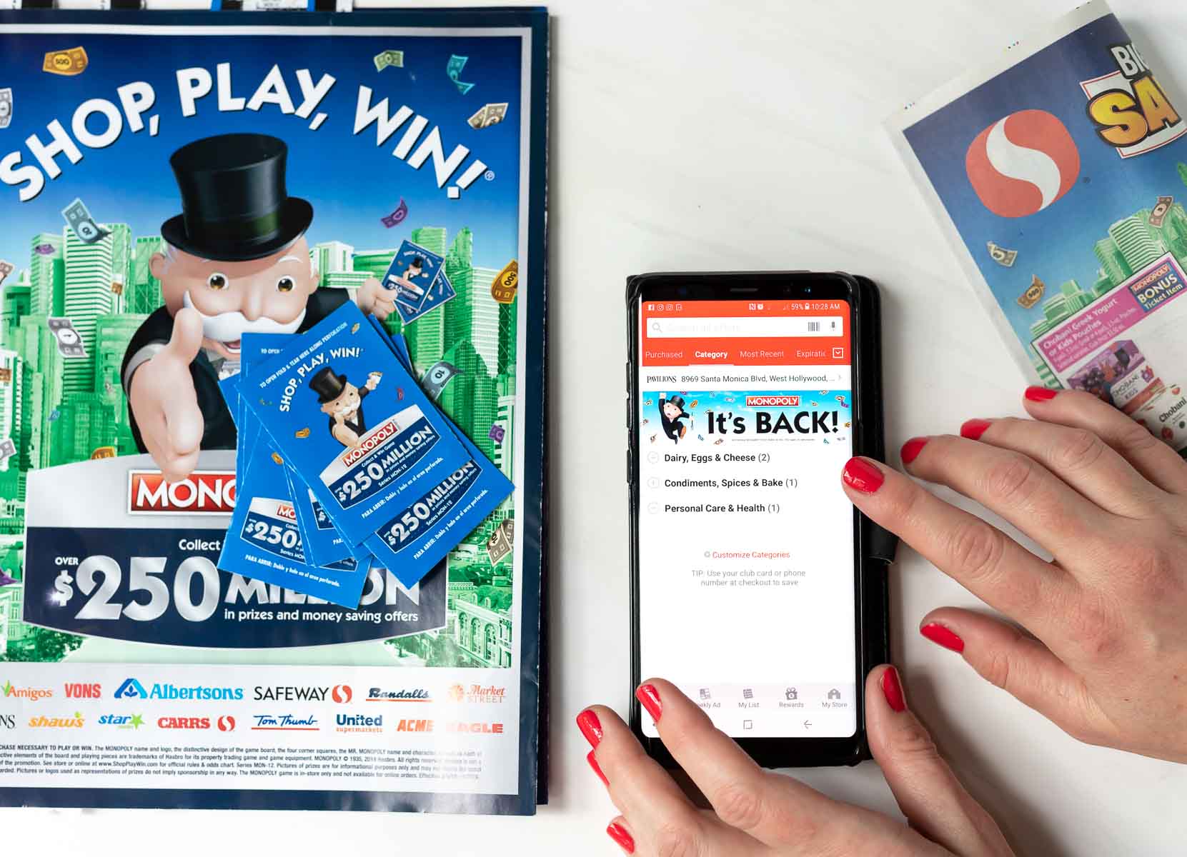 safeway ad next to smart phone with safeway savings app