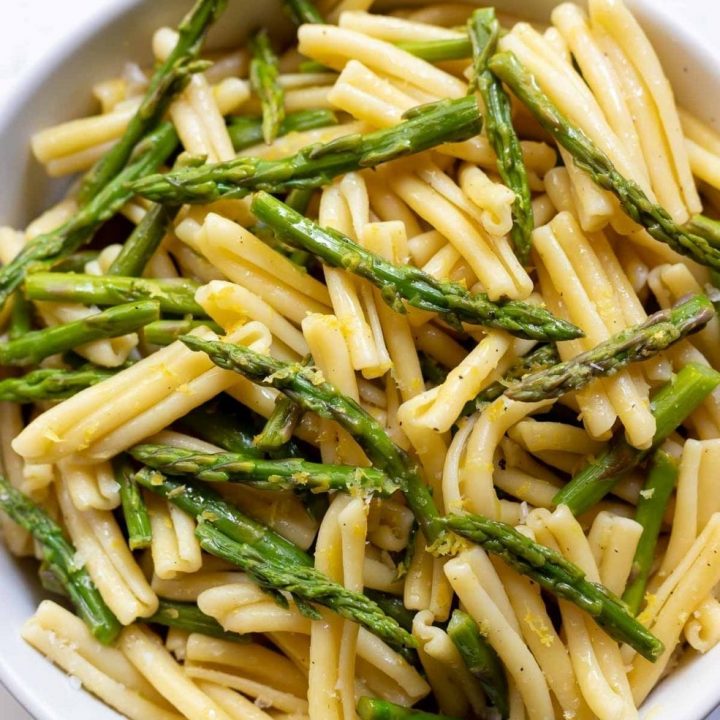 asparagus and pasta in white bowl