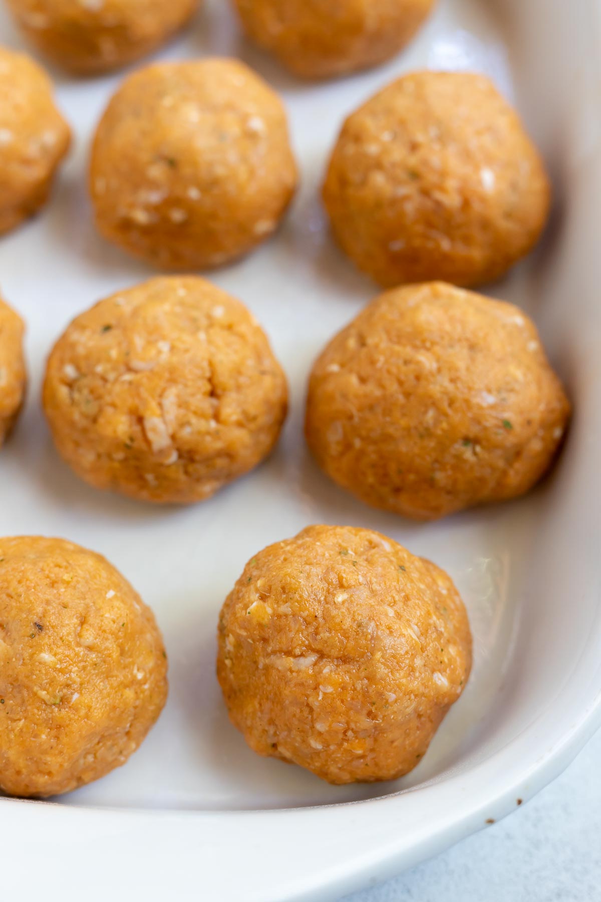 chicken meatballs in white roasting dish