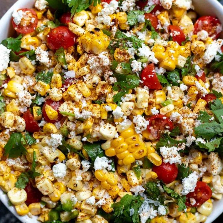 corn salad in a white serving bowl