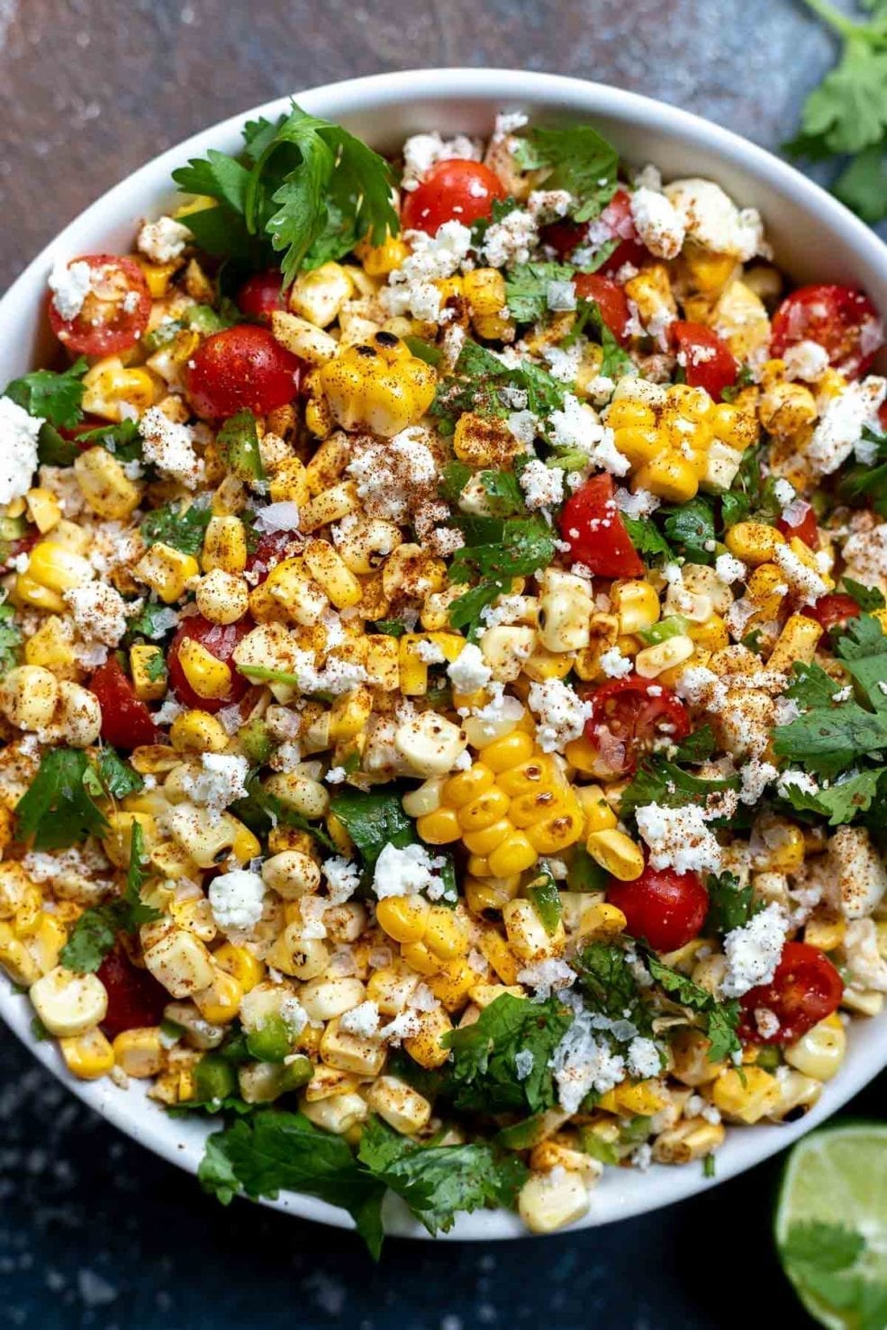 corn salad in a white serving bowl