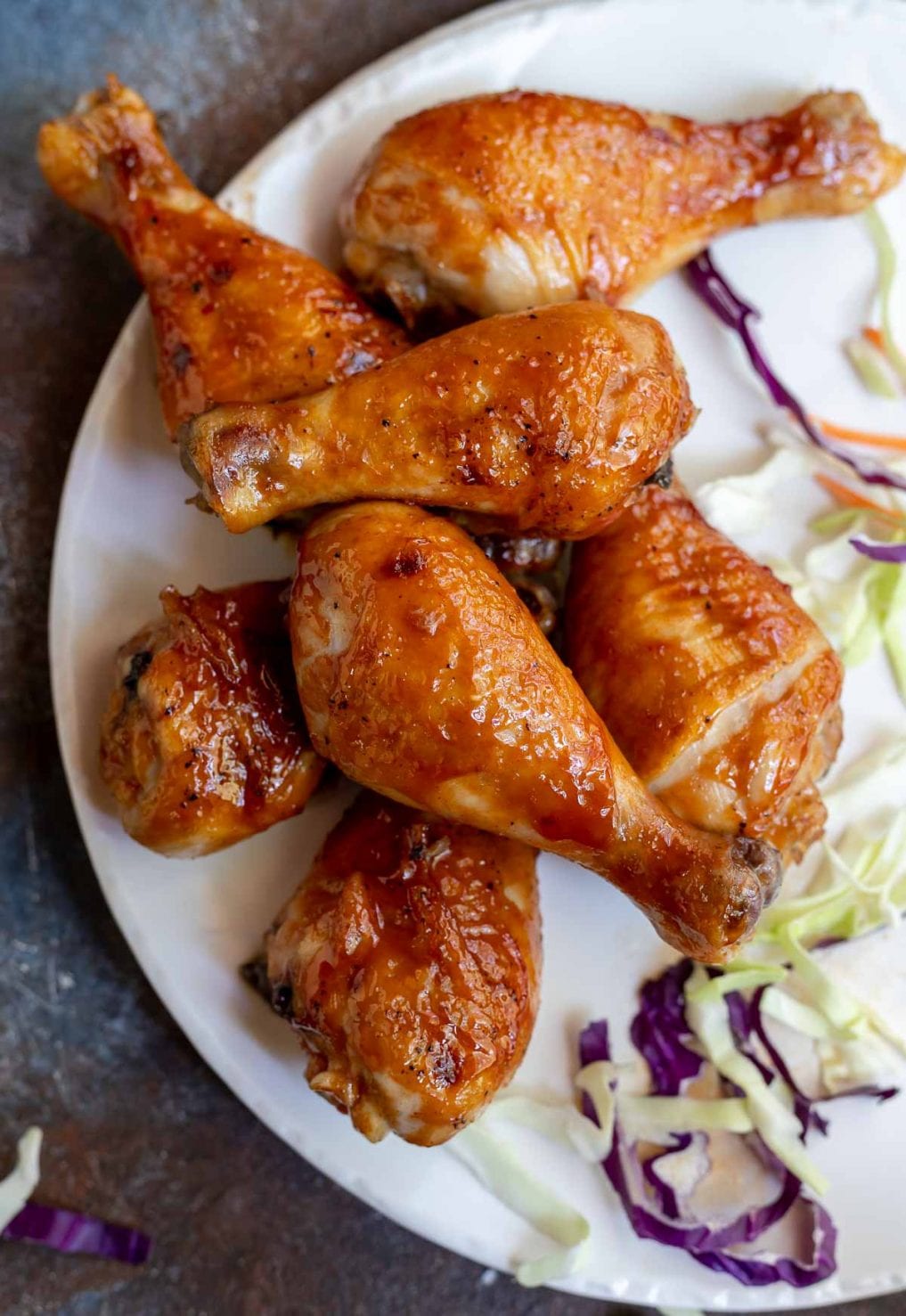 bbq chicken drumsticks served on white platter