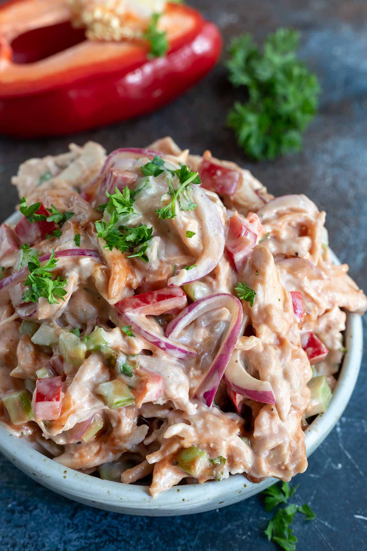 barbecue chicken salad in white bowl