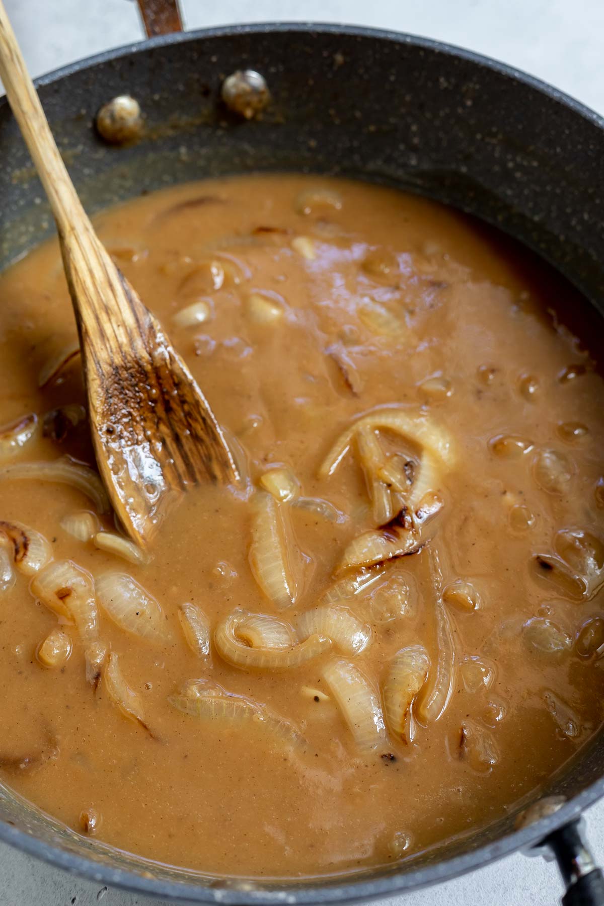 brown onion gravy in pan