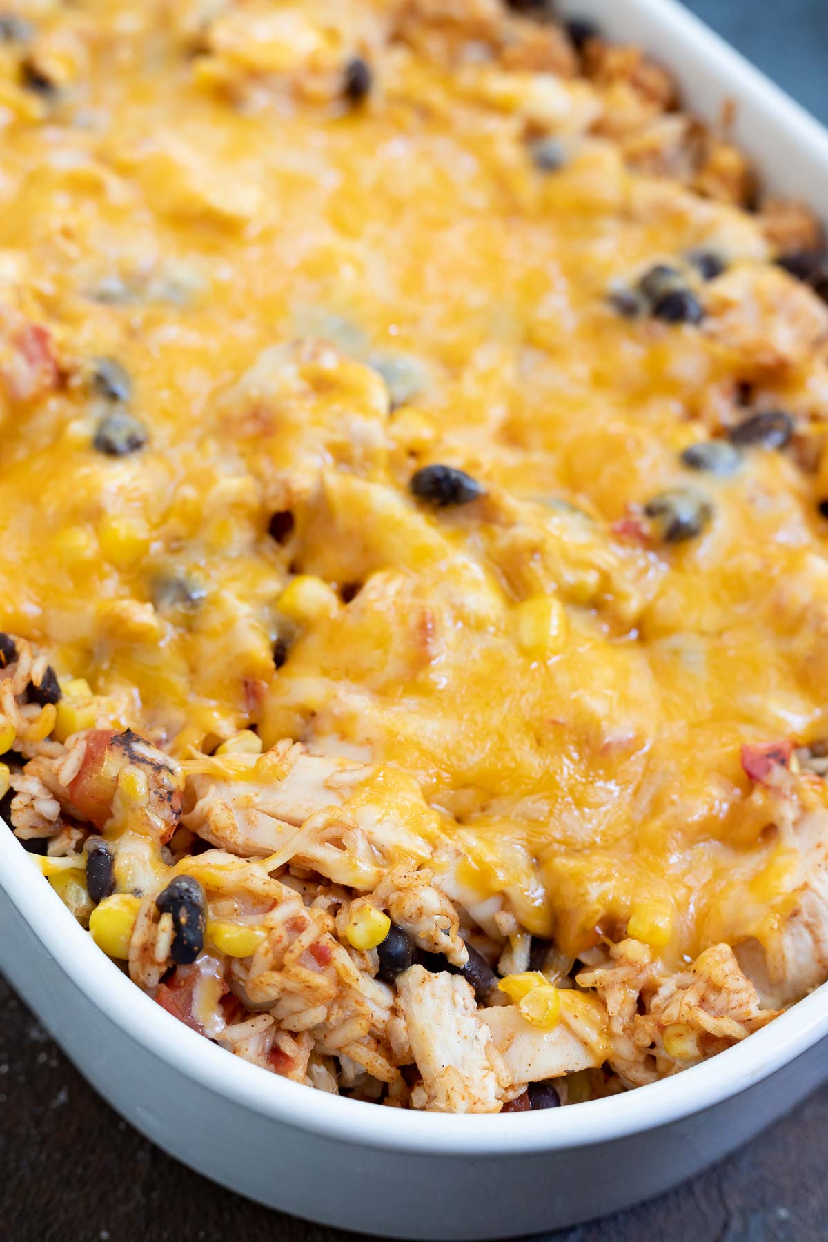 melty cheese on taco casserole before topping are put on top