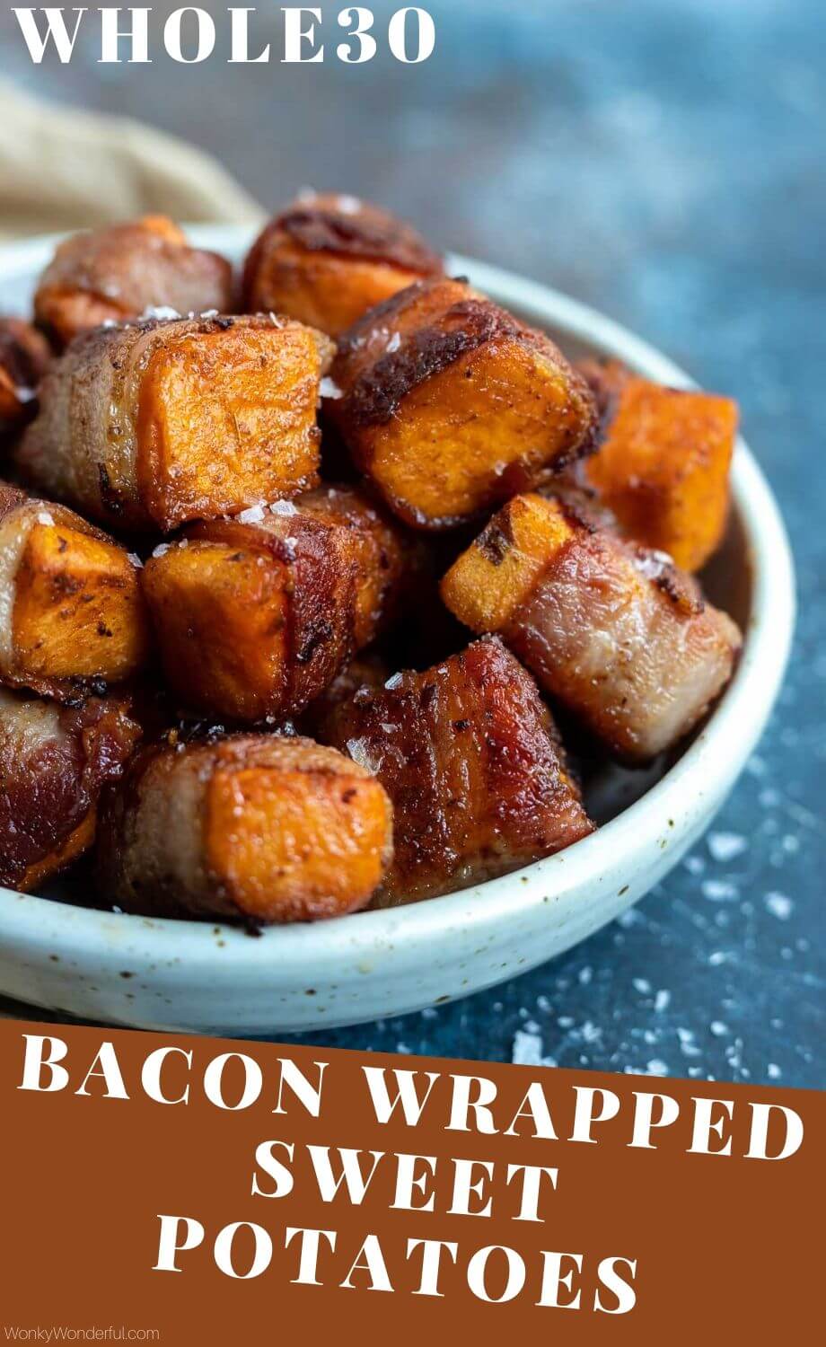 These Bacon Wrapped Sweet Potatoes are a fantastic Whole 30 holiday appetizer. Spiced sweet potatoes wrapped in bacon make the ultimate sweet - salty combo. #appetizerrecipes #sweetpotatorecipes #healthyholidayrecipes #whole30recipes #whole30 #whole30holidayrecipes #whole30diet