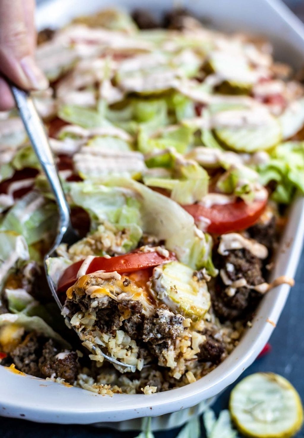 cheeseburger casserole being scooped with a serving spoon