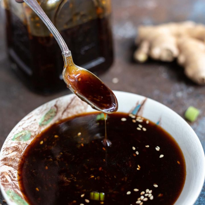 teriyaki sauce dripping down from spoon into small bowl