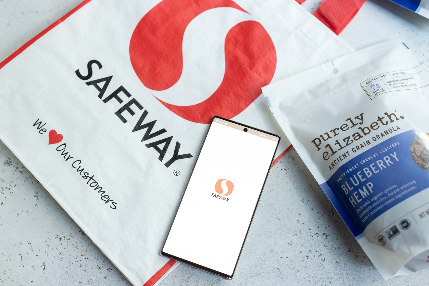 Safeway grocery bag next to bag of granola