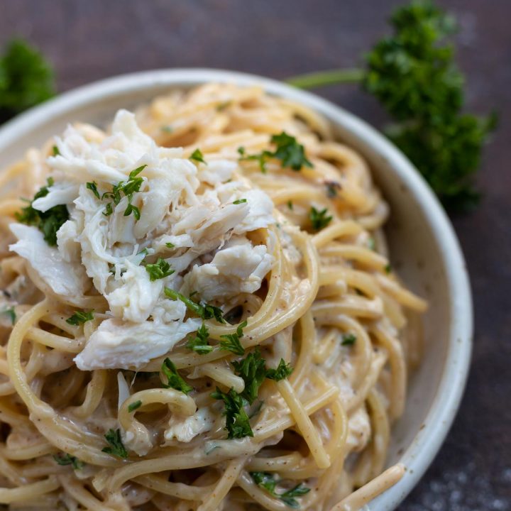creamy pasta topped with crab meat and parsley