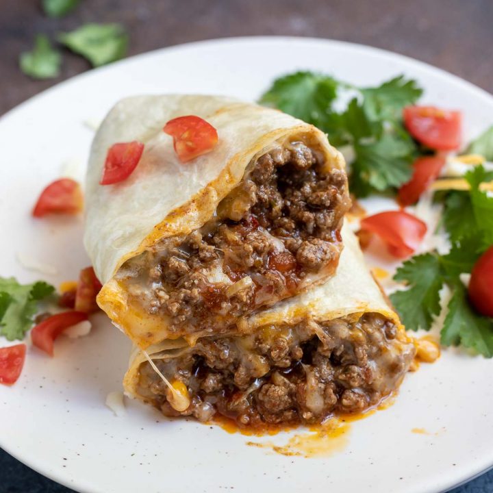 taco cut in half to show meat and cheese on the inside