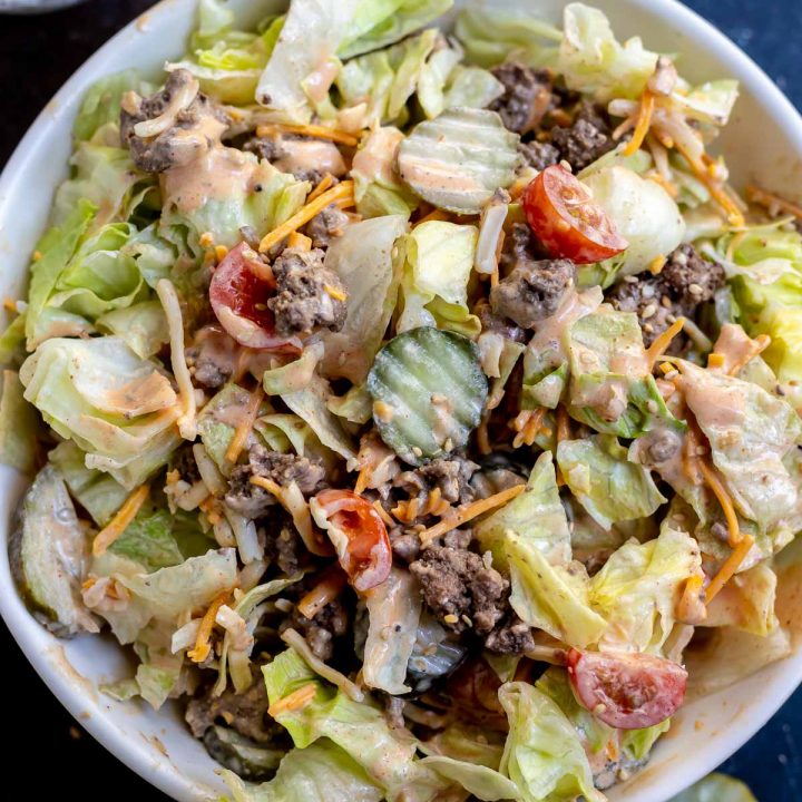 prepared salad and dressing in bowls