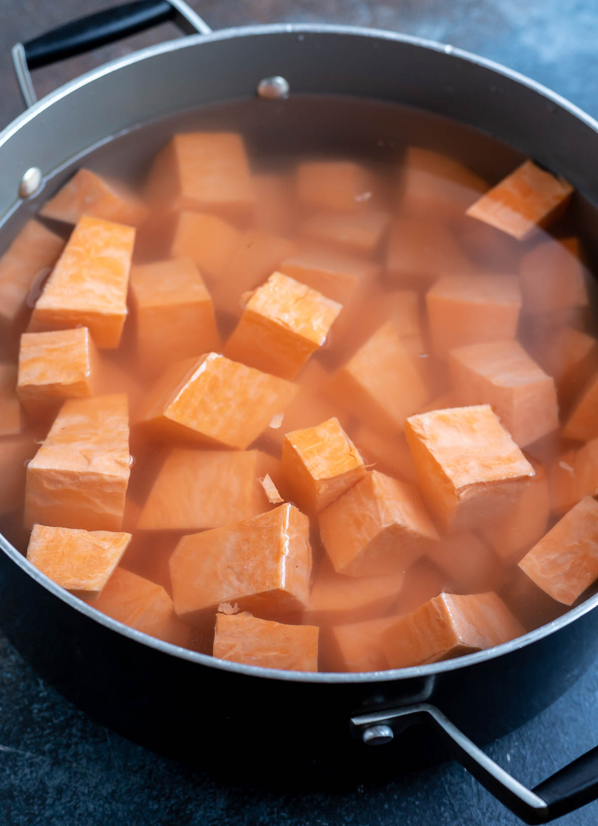 sweet potato cubes and water in pot