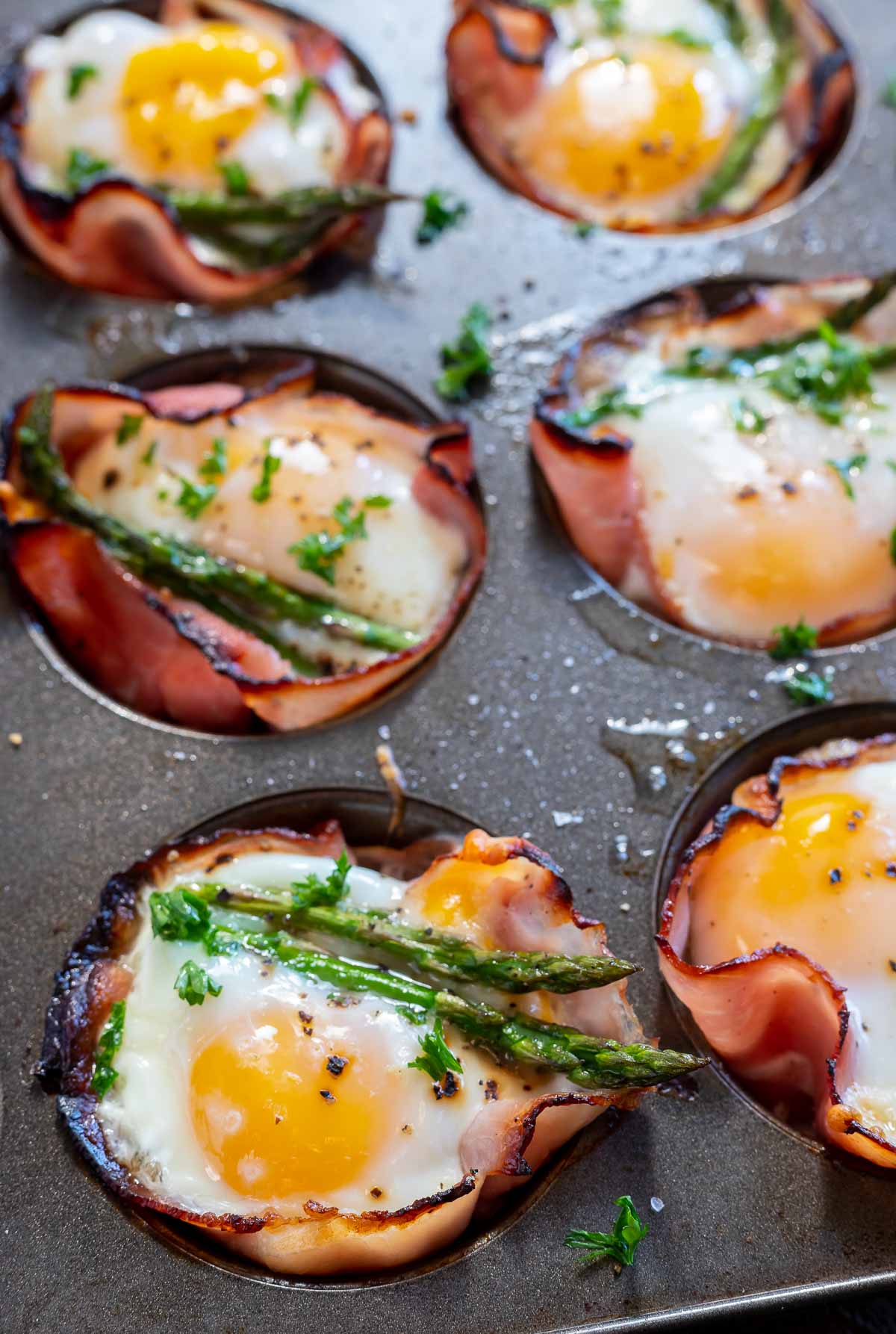 cooked ham egg cups in muffin tin