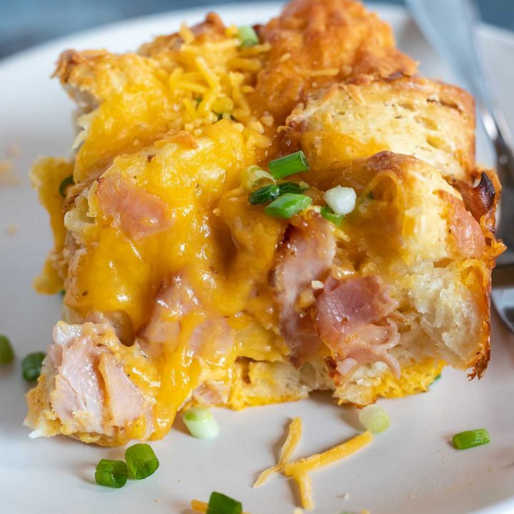 serving of breakfast casserole on white plate with fork