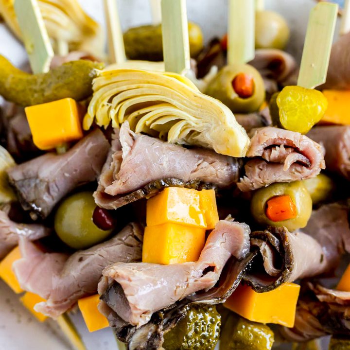 deli meat, pickles and cheese on wood skewer