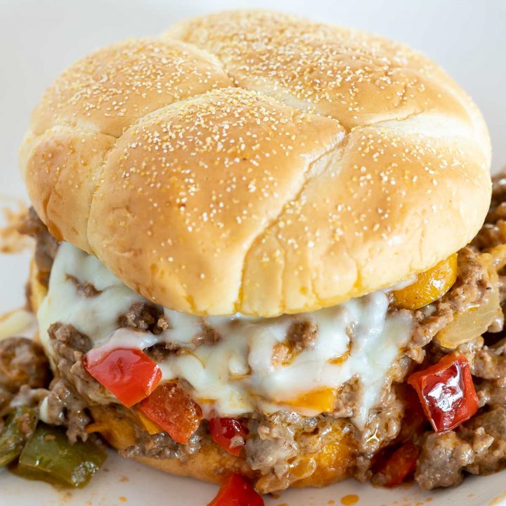 ground beef, peppers and cheese on toasted bun
