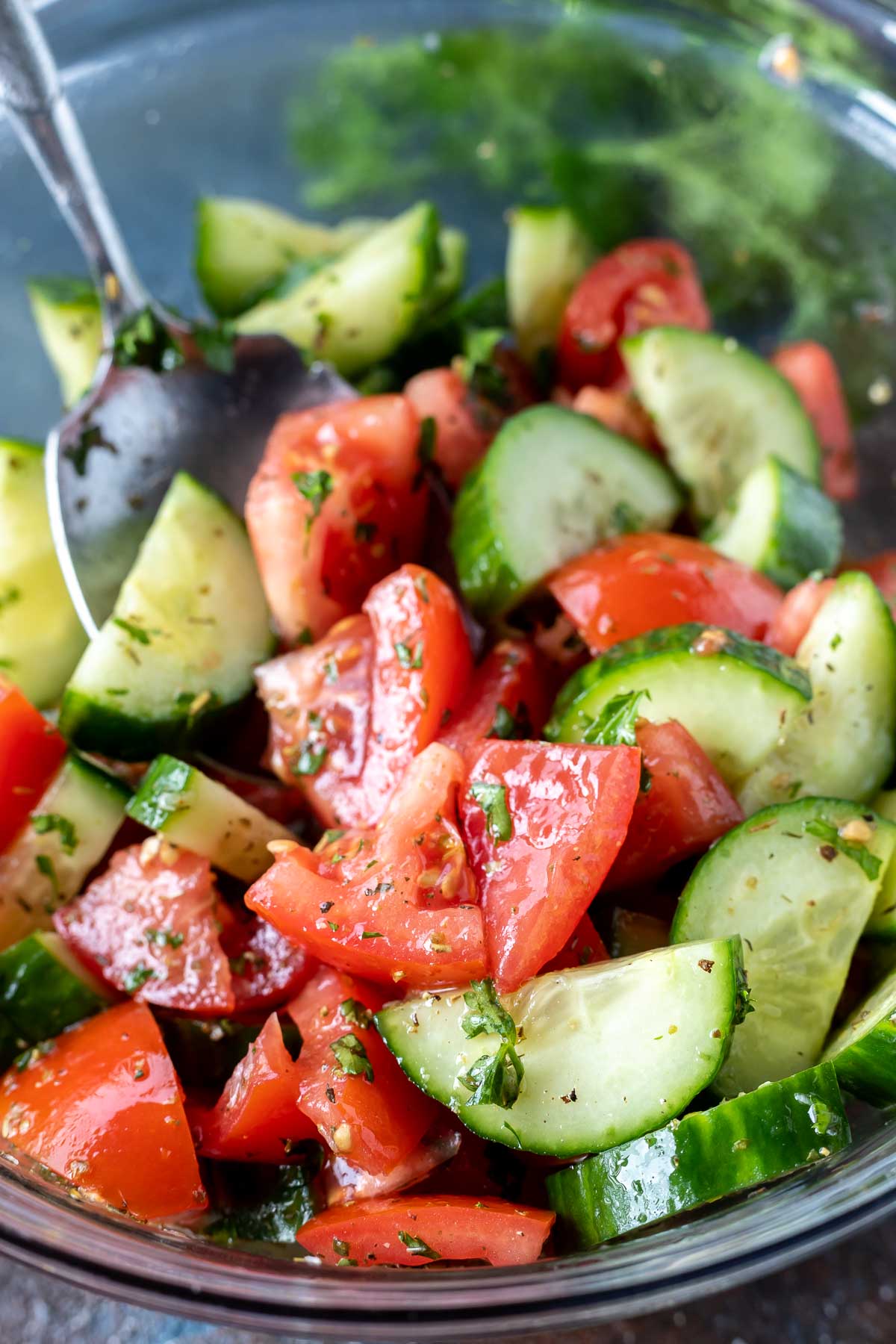 prepared cucumber salad in glass bowl