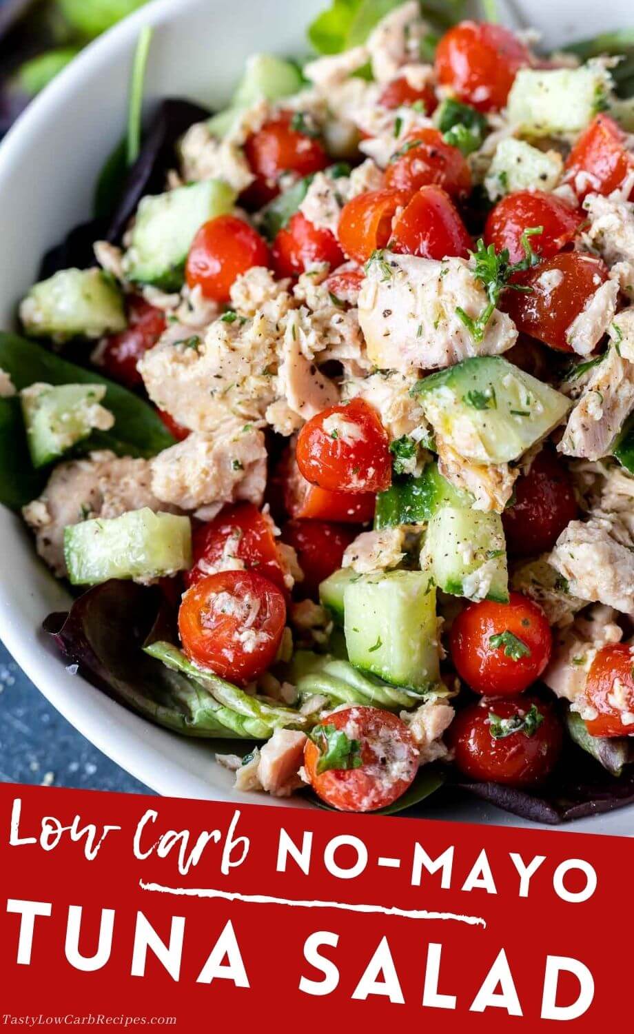 This Low Carb Tuna Salad Without Mayo recipe is certainly not lacking in flavor. Albacore tuna tossed with tomatoes, cucumbers and an olive oil citrus dressing makes a great Keto friendly lunch or dinner. #lowcarbrecipes #ketorecipes #tunarecipes #tunasaladrecipes #tunasaladnomayo #lowcarb tuna salad no mayo pinnable image with title text