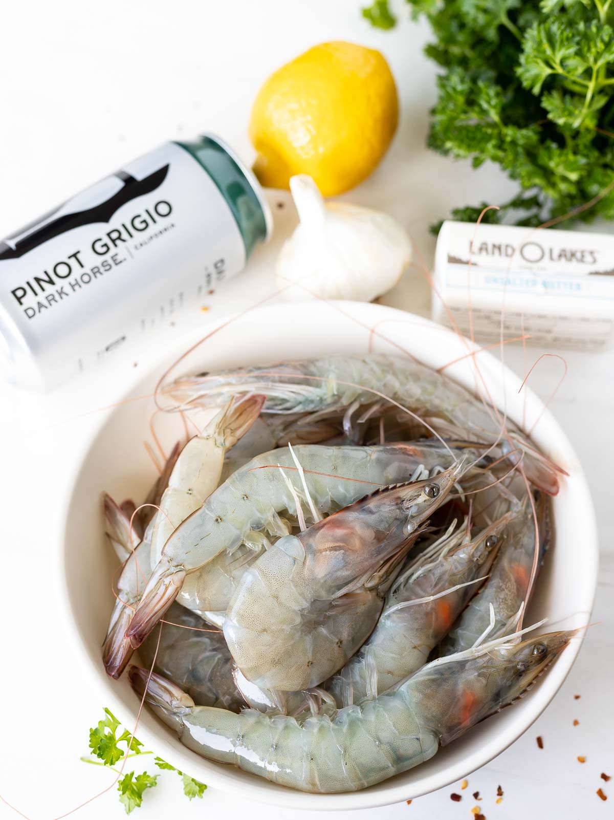 raw shrimp, can of wine, lemon, stick of butter, garlic and parsley