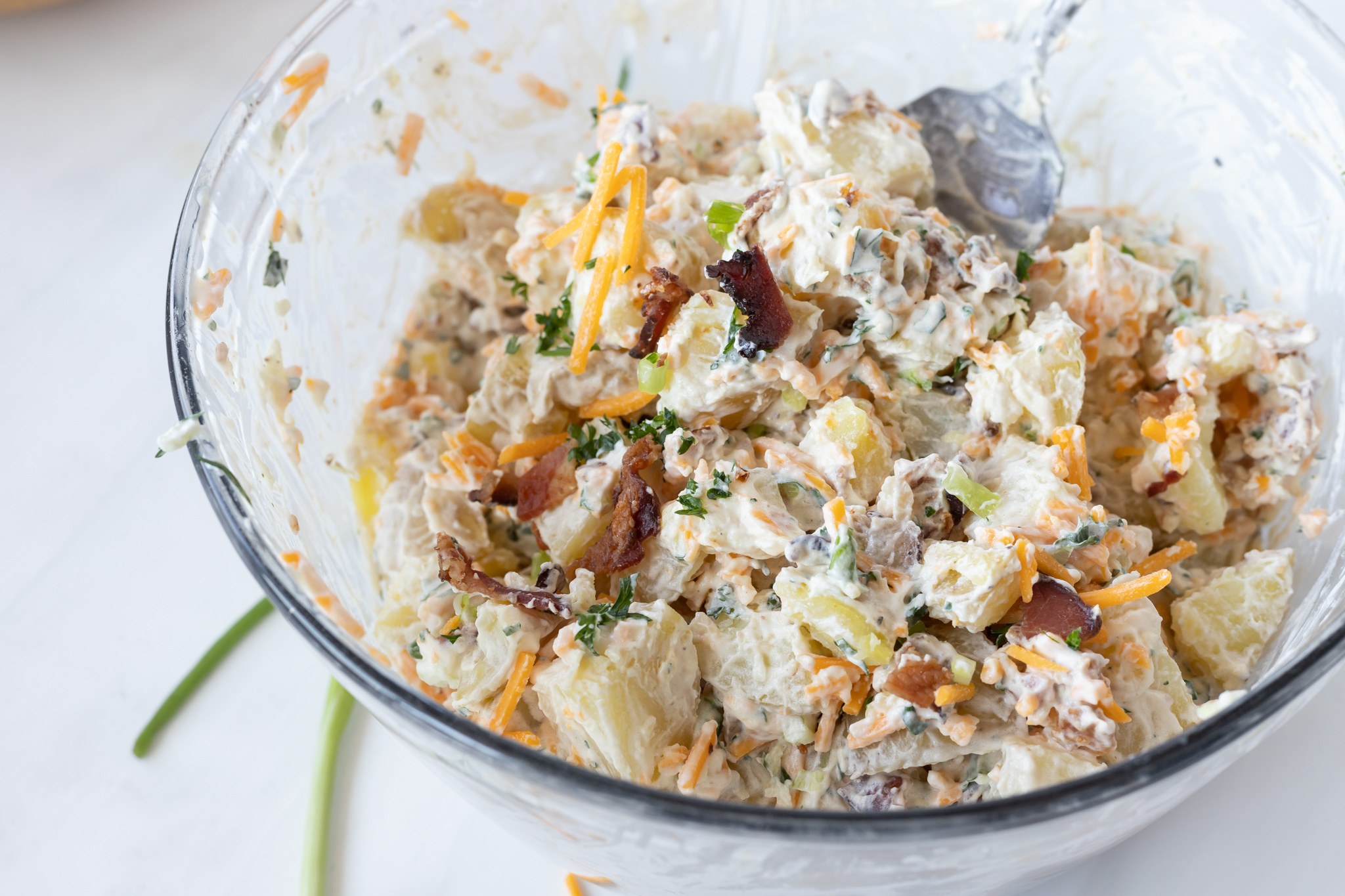 mixed potato salad in glass bowl